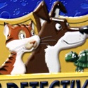 illustration of Dozens of pets have been lost! Race against other pet detectives to locate them. Find the most pets and you win the game! Final package was released both in a box and in a tin box as shown here. 